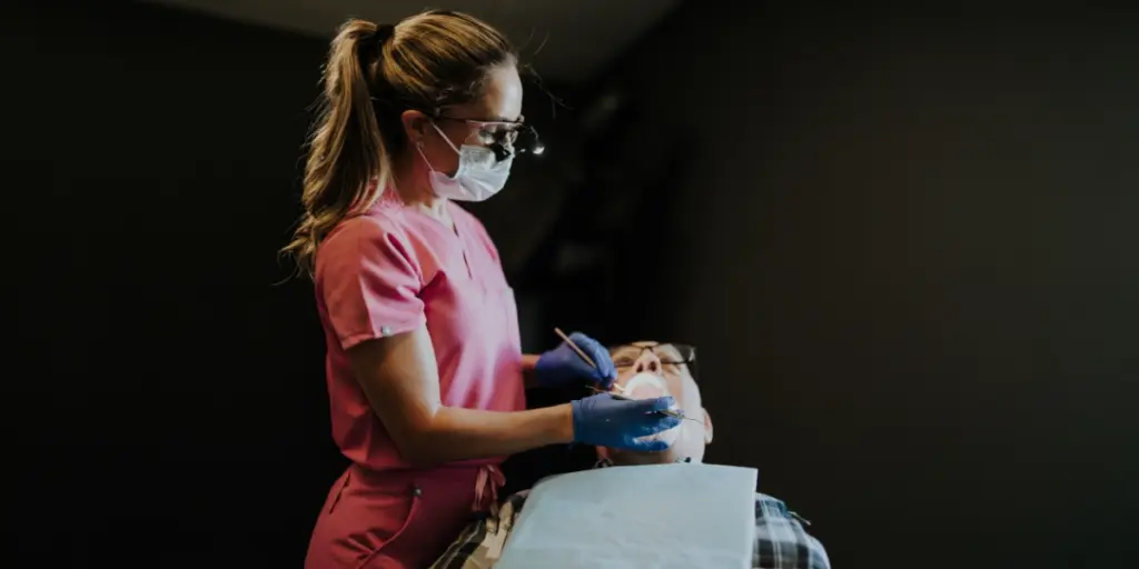 Sherly Johnson performing a deep cleaning for a patient